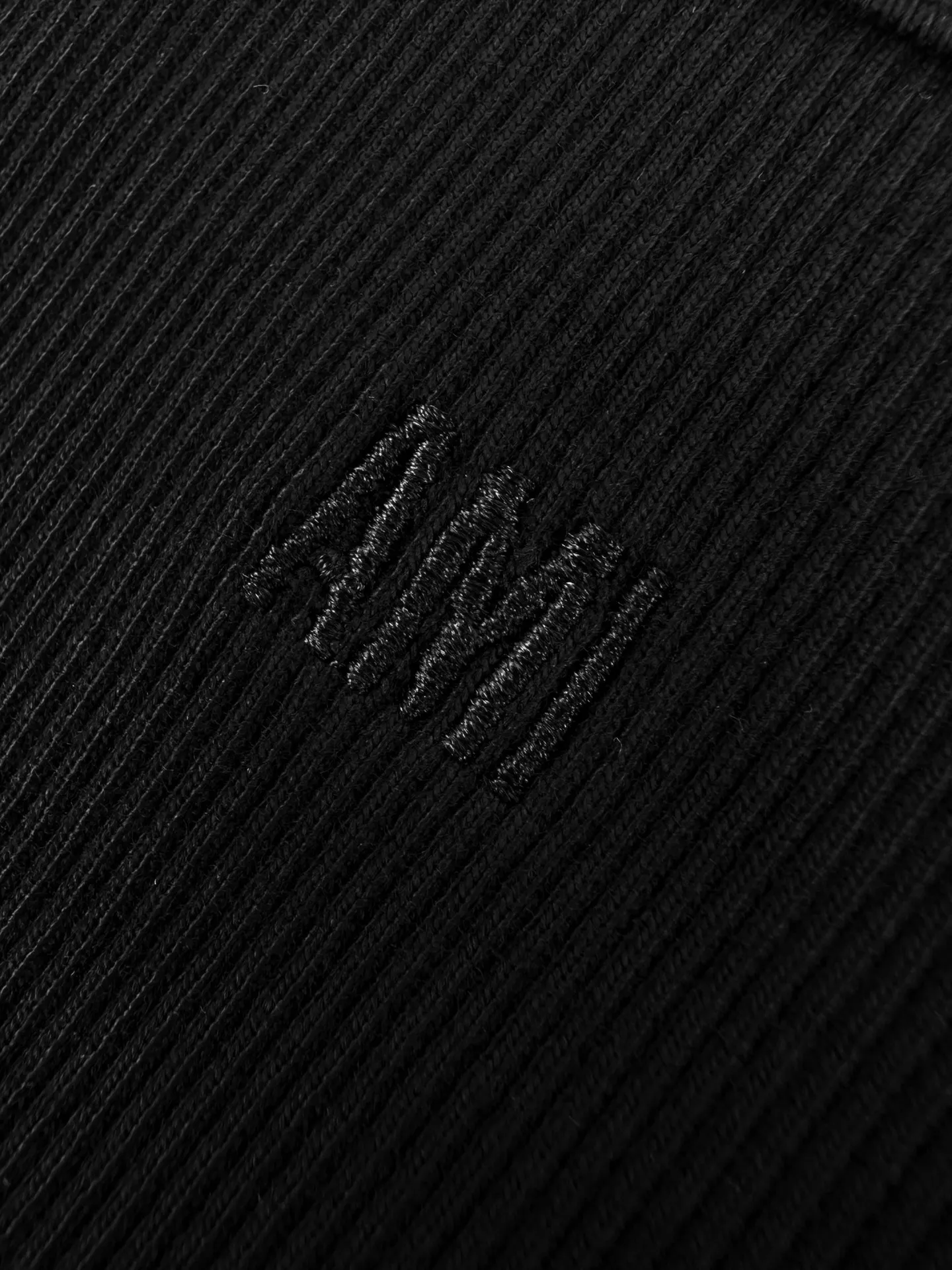 Logo embroidered vest Customized luxurious and soft plain cotton, cloudy and skin-friendly, clean and refreshing Breathable, simple black tones embody French sophistication, showing a luxurious style when relaxed. Love logo lightly embroidered on the front, Ami embroidery on the back neck with dark engraved texture, French attitude on both sides, minimalist and quality, interior with hidden charm, easy to wear alone, Versatile is elegant and effortless. Process 1: Using imported machine embroidery technology Use advanced computer control systems and precision mechanical components to achieve Ami logo and letter embroidery operations with high precision and smooth and delicate lines. Process 2: The fabrics have been fermented and washed for a better hand feel. Not easy to deform, not easy to shrink, not easy to fade, and maintain long-term beauty. Accessories: Customized 1:1 Ami trademark. Version: Fitted version. Size: S M L XL. Style number: AA 603.